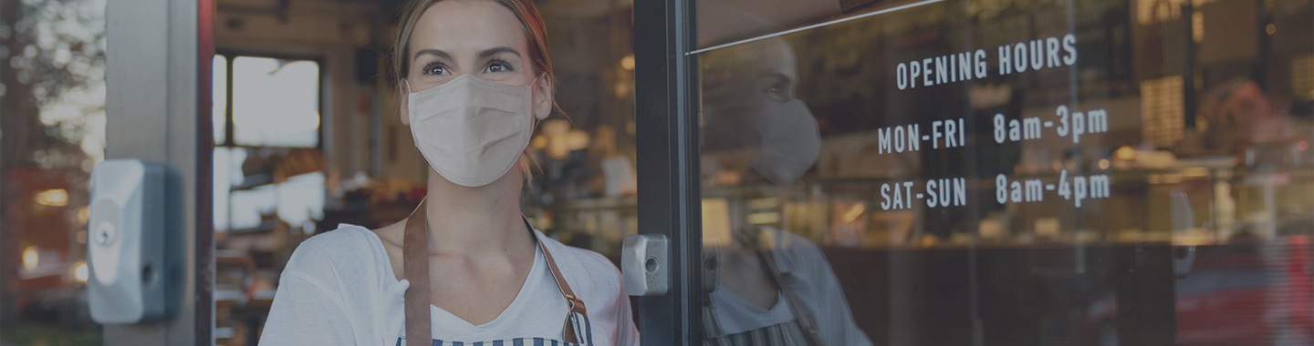 Small business owner with a face mask.