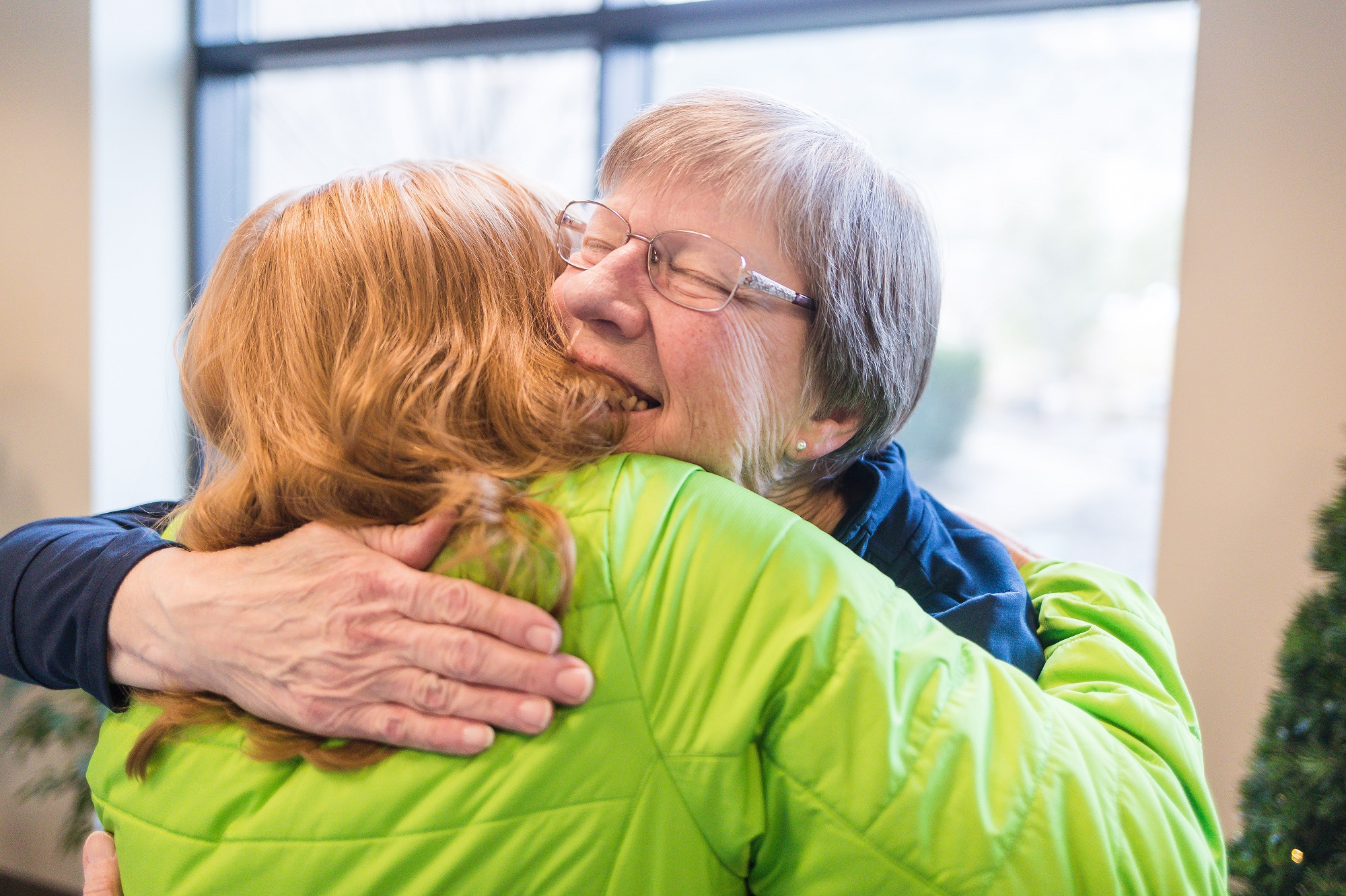 Image of Lynette getting a hug at the branch