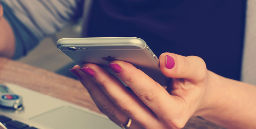 Closeup of a woman's hand holding a smartphone