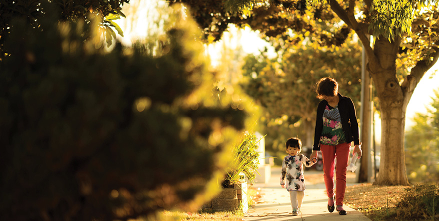 Image of mother and daughter walking in the dusk